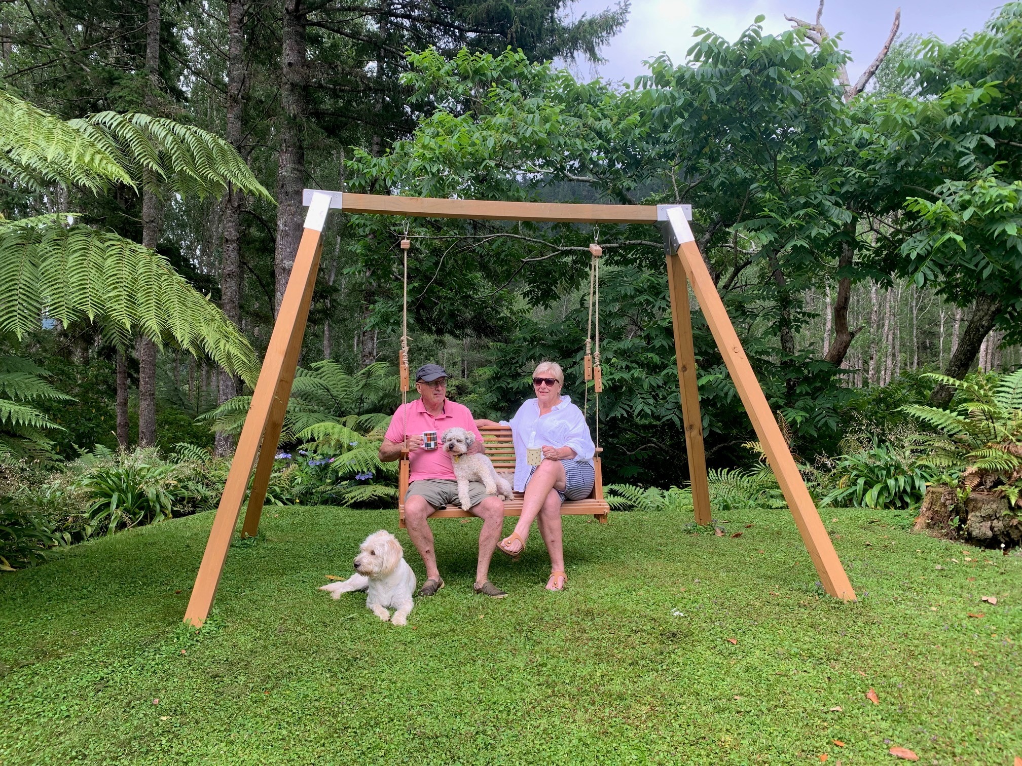 Mo & Co swing and frame enjoyed in a garden setting